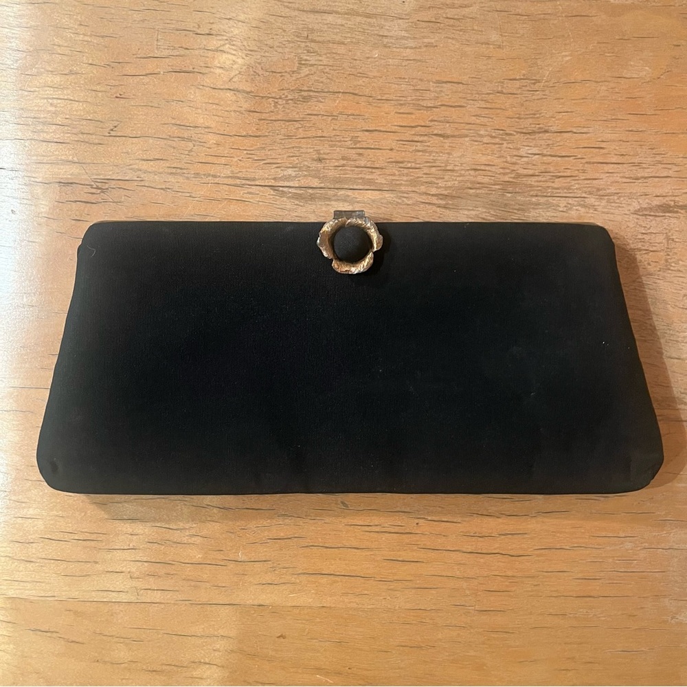 Vintage clutch with a brass flower clasp